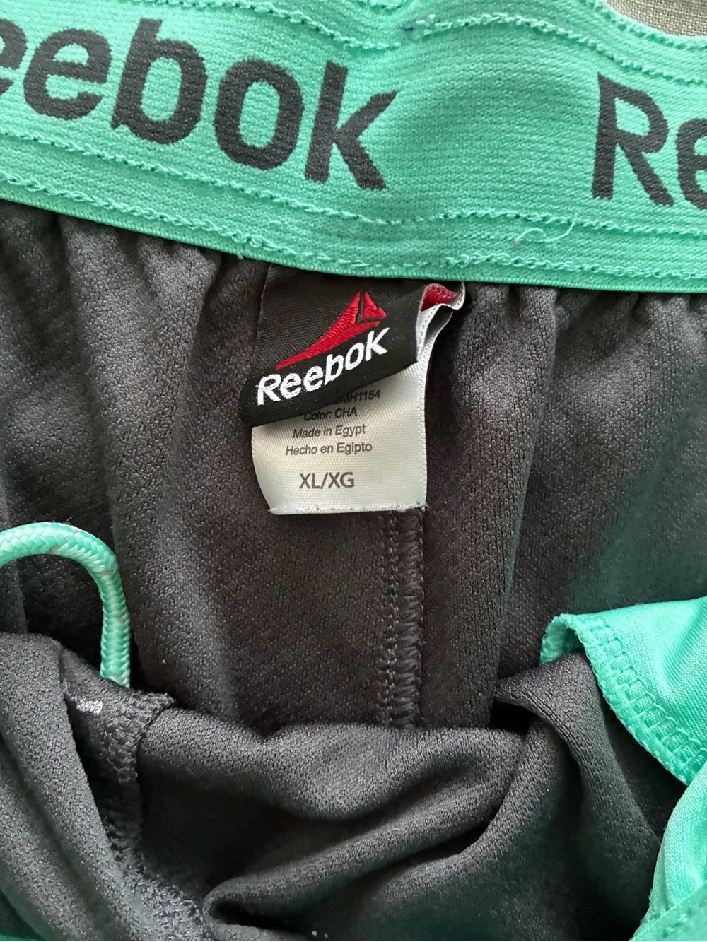 Reebok Men’s Black Athletic Shorts with Teal Trim